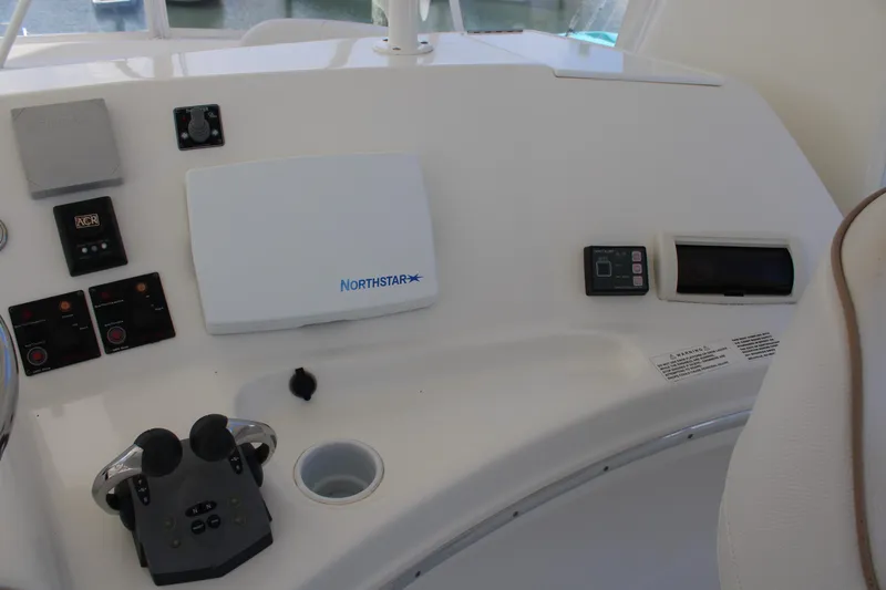 Worth The Wake Yacht Photos Pics Control panel of a 2006 Silverton 42 Convertible yacht with navigation equipment.