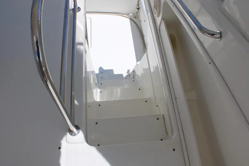 Worth The Wake Yacht Photos Pics Staircase on 2006 Silverton 42 Convertible yacht with stainless steel handrails.