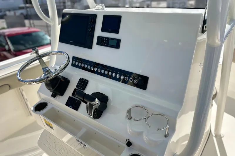  Yacht Photos Pics 2023 Key West 263 FS boat dashboard with steering wheel and control panel.