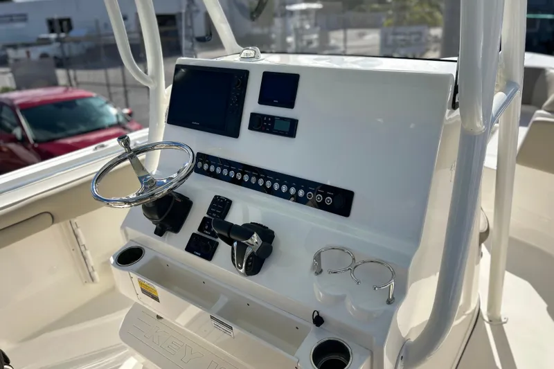  Yacht Photos Pics 2023 Key West 263 FS boat console with steering wheel and navigation controls.