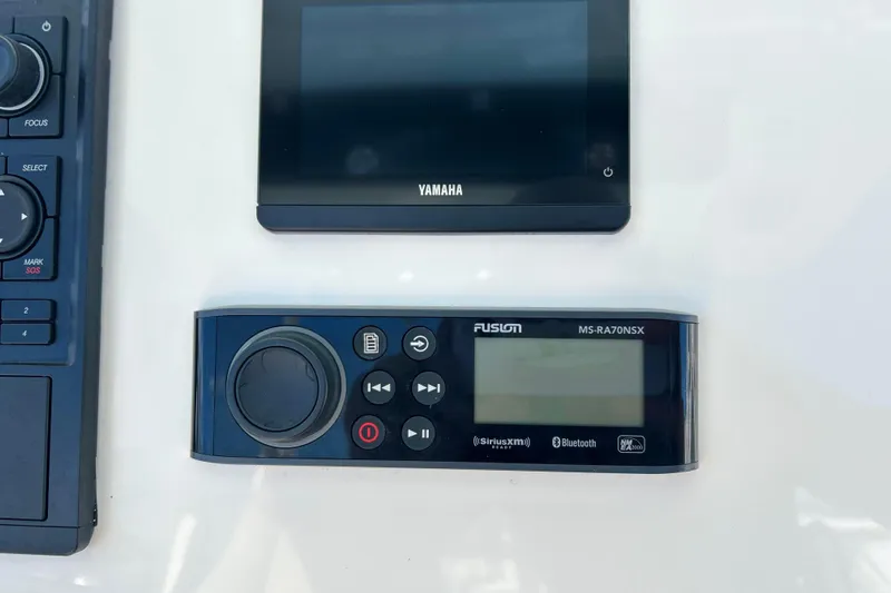  Yacht Photos Pics Control panel of 2023 Key West 263 FS boat with Yamaha and Fusion audio systems.