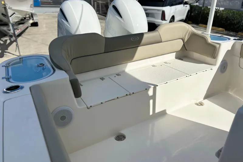  Yacht Photos Pics 2023 Key West 263 FS boat interior with cushioned seating and storage compartments.