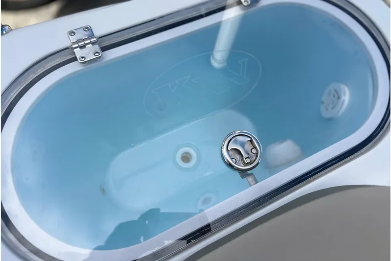  Yacht Photos Pics Livewell of 2023 Key West 263 FS boat, featuring a clear lid and stainless steel latch.
