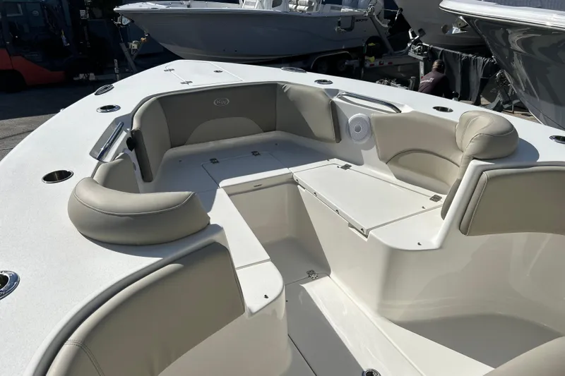  Yacht Photos Pics 2023 Key West 263 FS boat interior with cushioned seating and storage compartments.