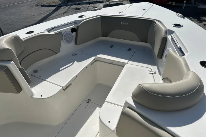  Yacht Photos Pics 2023 Key West 263 FS boat interior with cushioned seating and storage compartments.
