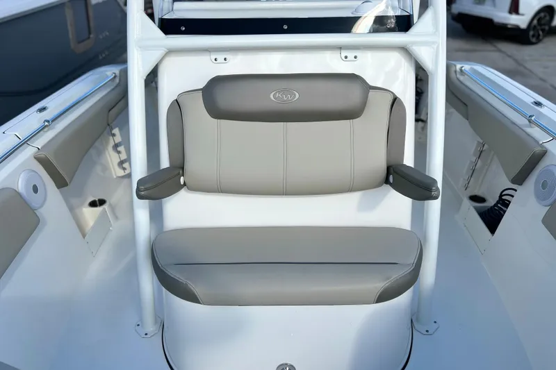  Yacht Photos Pics 2023 Key West 263 FS boat interior with cushioned seating and armrests.