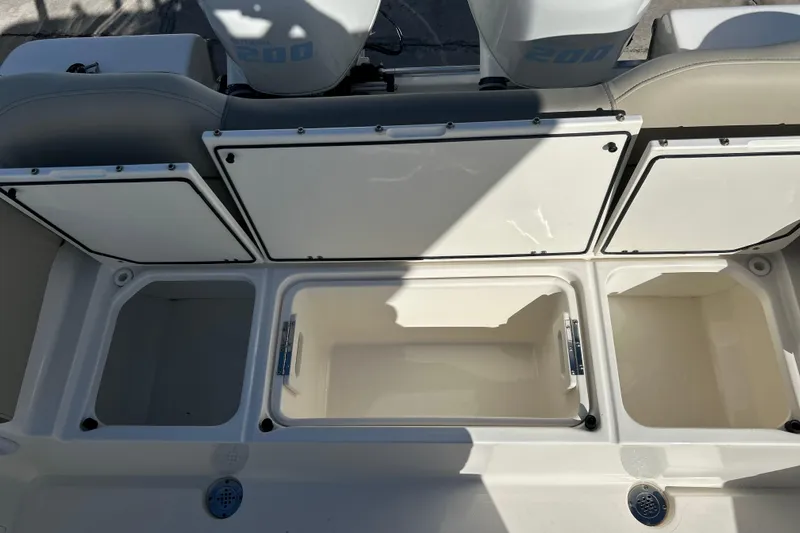  Yacht Photos Pics 2023 Key West 263 FS boat storage compartments with open lids, showcasing spacious interior.