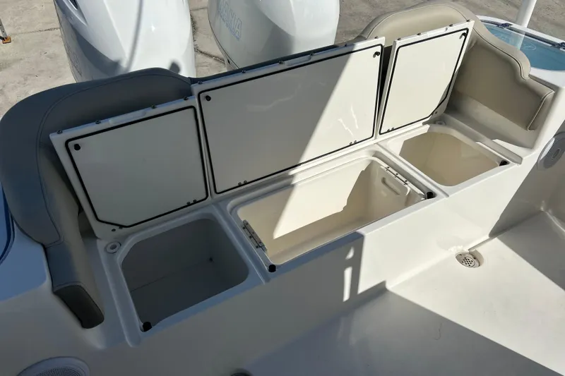  Yacht Photos Pics 2023 Key West 263 FS boat storage compartments open, showcasing spacious interior design.