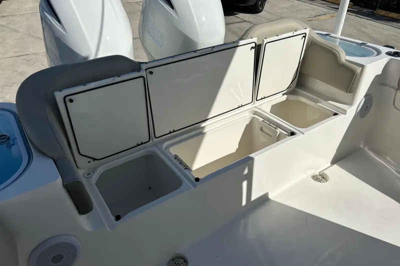  Yacht Photos Pics 2023 Key West 263 FS boat storage compartments and seating area.