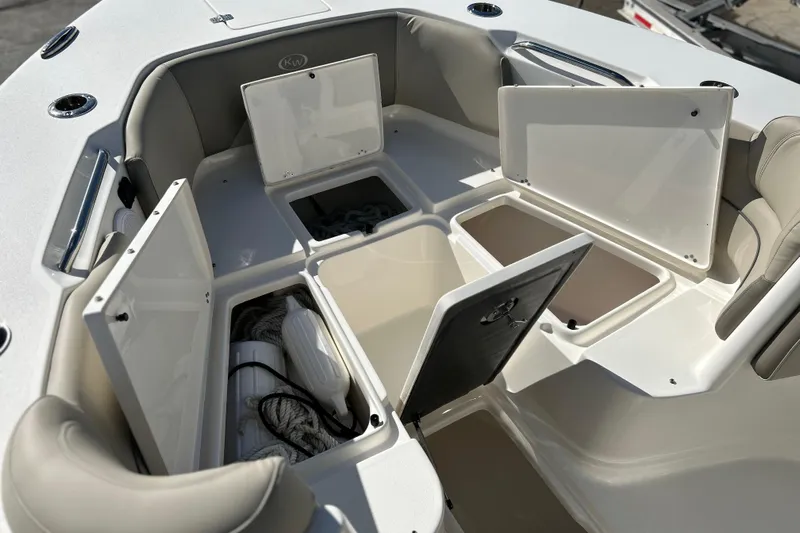  Yacht Photos Pics 2023 Key West 263 FS boat storage compartments open, showcasing ample space and organization.
