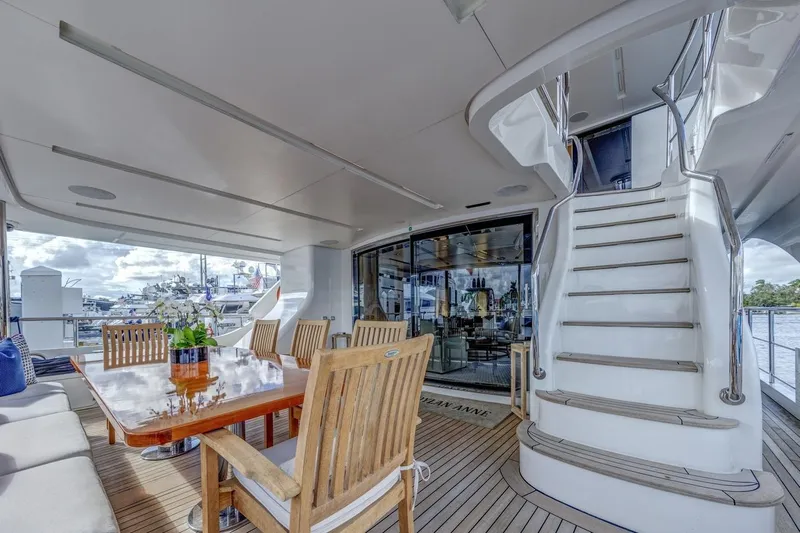 Dylan Anne Yacht Photos Pics Luxurious 2015 Benetti Traditional Supreme 108 yacht deck with elegant dining area and staircase.