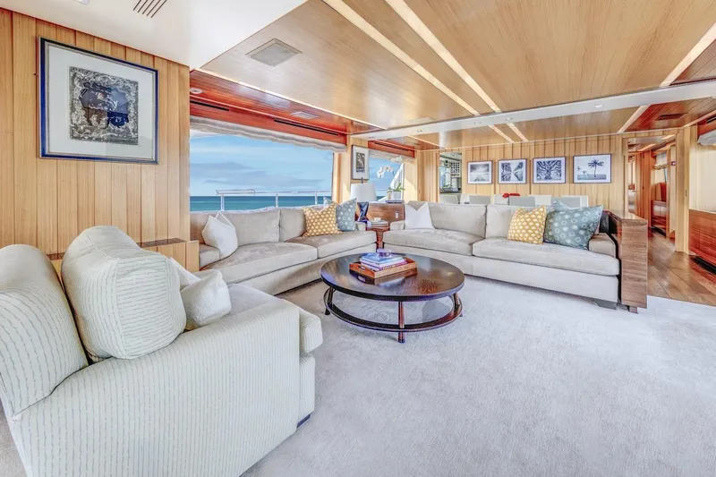 Dylan Anne Yacht Photos Pics Luxurious interior of 2015 Benetti Traditional Supreme 108 yacht with elegant seating and ocean view.