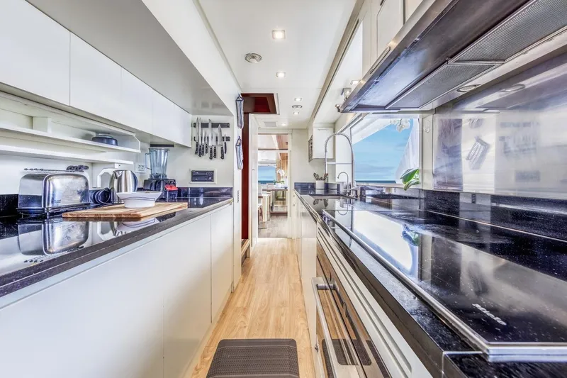 Dylan Anne Yacht Photos Pics Luxurious kitchen interior of 2015 Benetti Traditional Supreme 108 yacht, featuring modern appliances.