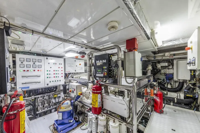 Dylan Anne Yacht Photos Pics Engine room of 2015 Benetti Traditional Supreme 108 yacht, featuring control panels and machinery.