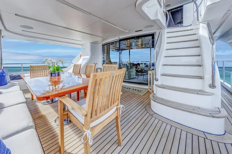 Dylan Anne Yacht Photos Pics Luxurious deck of 2015 Benetti Traditional Supreme 108 yacht with elegant seating and ocean view.