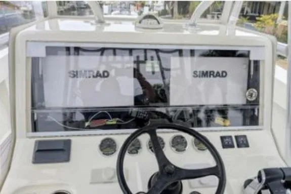 Hazard Pay Yacht Photos Pics 2017 SeaVee 390Z boat dashboard with dual Simrad displays and steering wheel.