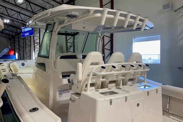  Yacht Photos Pics 2026 Grady-White Canyon 336 boat interior with seating and helm station in showroom.