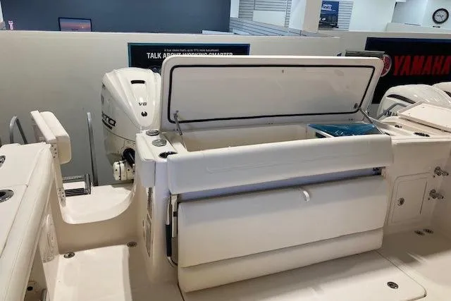  Yacht Photos Pics 2026 Grady-White Canyon 336 boat with open storage compartment and Yamaha V8 engine.