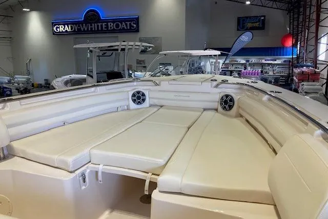  Yacht Photos Pics 2026 Grady-White Canyon 336 boat interior with cushioned seating in showroom.