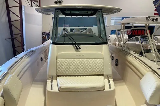  Yacht Photos Pics 2026 Grady-White Canyon 336 boat interior with cushioned seating and modern design.