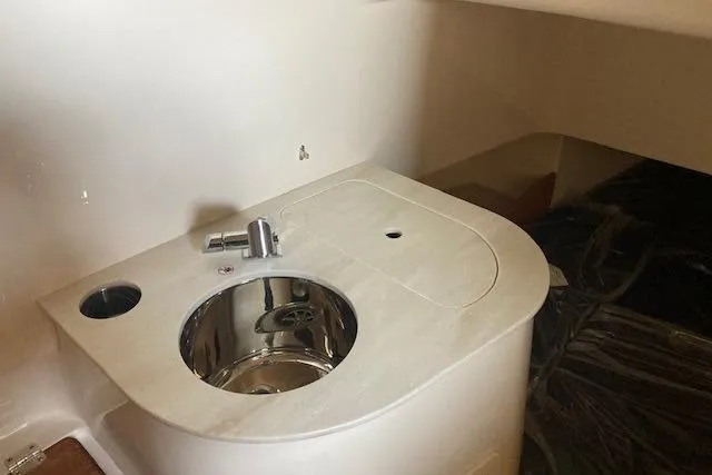  Yacht Photos Pics 2026 Grady-White Canyon 336 boat interior with compact sink and faucet.