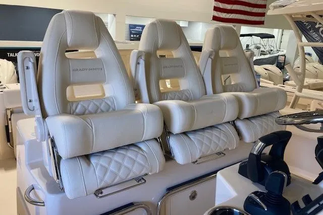  Yacht Photos Pics Luxurious seating on 2026 Grady-White Canyon 336 boat, featuring plush white upholstery.