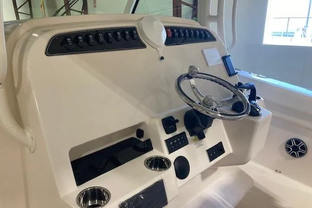 Yacht Photos Pics 2026 Grady-White Canyon 336 helm with steering wheel and control panel.