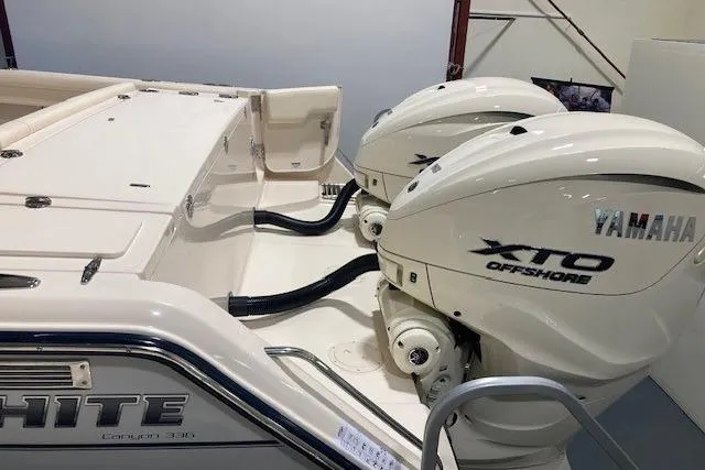  Yacht Photos Pics 2026 Grady-White Canyon 336 boat with Yamaha XTO Offshore engines in a showroom.