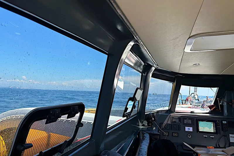  Yacht Photos Pics Interior view of 2026 Rapido 60 yacht cockpit with ocean view through windows.