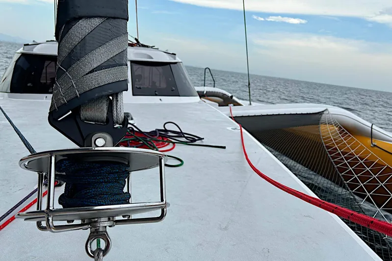  Yacht Photos Pics Sailing on a 2026 Rapido 60 trimaran, featuring deck rigging and ocean view.