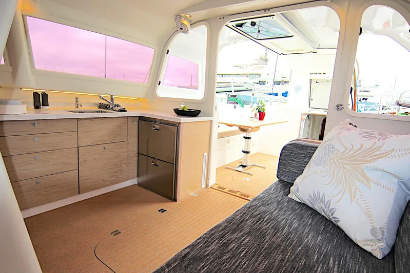  Yacht Photos Pics Luxurious interior of 2026 Rapido 60 yacht with modern kitchen and seating area.