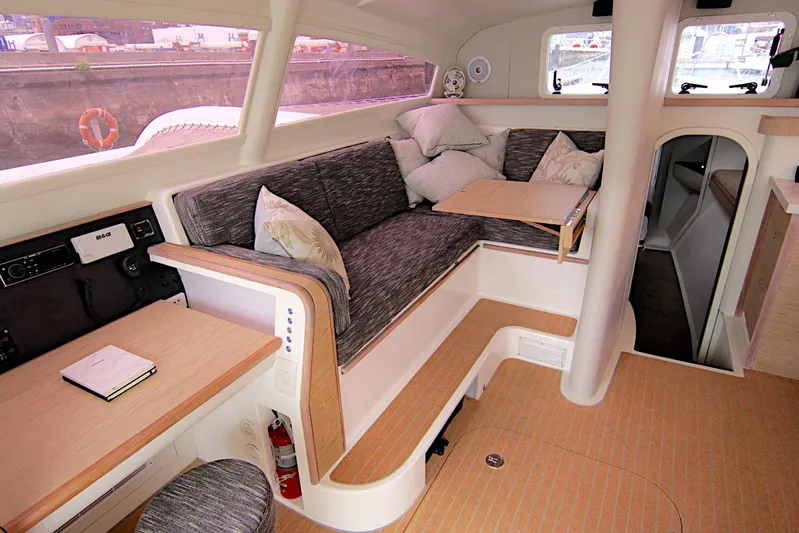  Yacht Photos Pics Luxurious interior of 2026 Rapido 60 yacht with cozy seating and modern design.