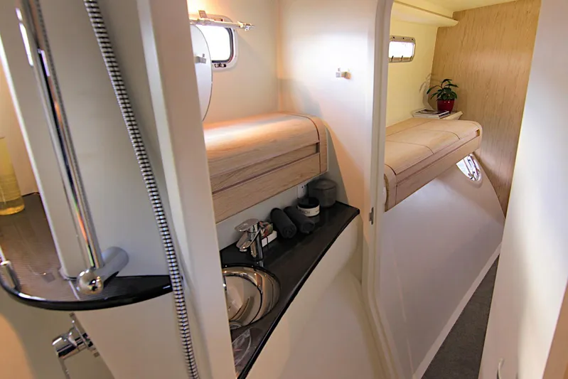  Yacht Photos Pics Interior of 2026 Rapido 60 yacht featuring modern bathroom and cozy cabin.