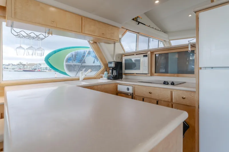 Silvius Brabo Yacht Photos Pics Interior of 2000 Navigator 53 Classic yacht kitchen with modern appliances and large windows.