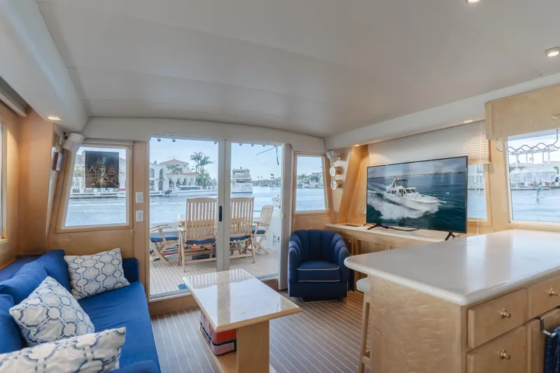 Silvius Brabo Yacht Photos Pics Interior of 2000 Navigator 53 Classic yacht with cozy seating and waterfront view.