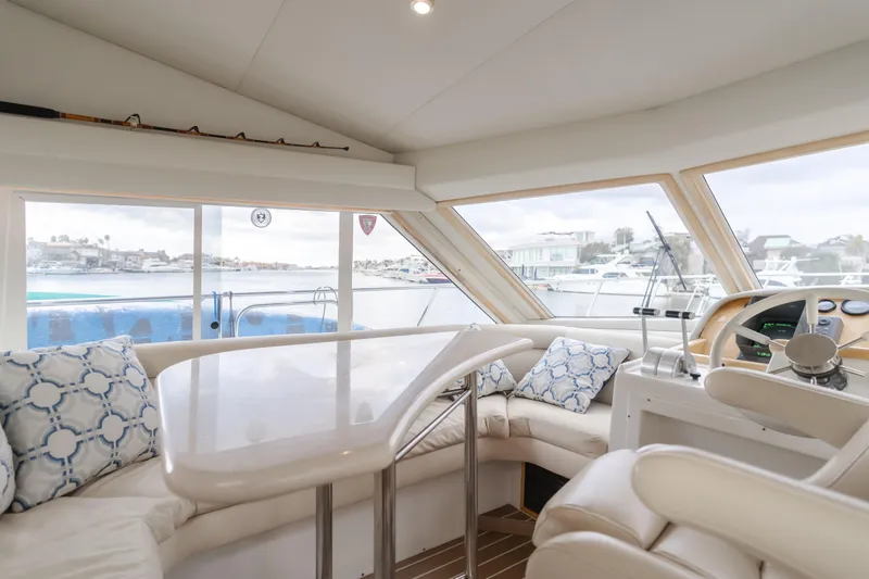 Silvius Brabo Yacht Photos Pics Interior of 2000 Navigator 53 Classic yacht with plush seating and panoramic windows.
