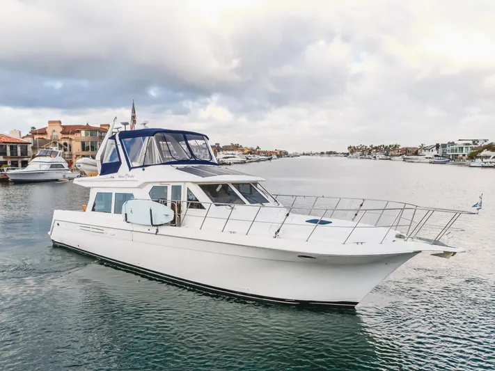 Silvius Brabo Yacht Photos Pics Navigator 53 Classic 2000 yacht cruising in a scenic waterfront setting.