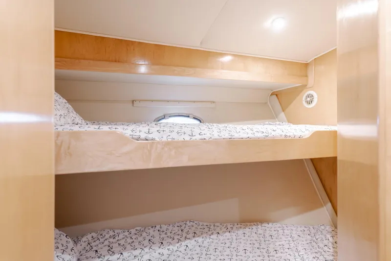 Silvius Brabo Yacht Photos Pics Bunk beds in 2000 Navigator 53 Classic yacht cabin with wooden finish.
