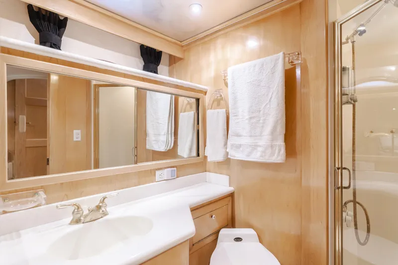 Silvius Brabo Yacht Photos Pics Luxurious bathroom in 2000 Navigator 53 Classic yacht with elegant fixtures and spacious shower.