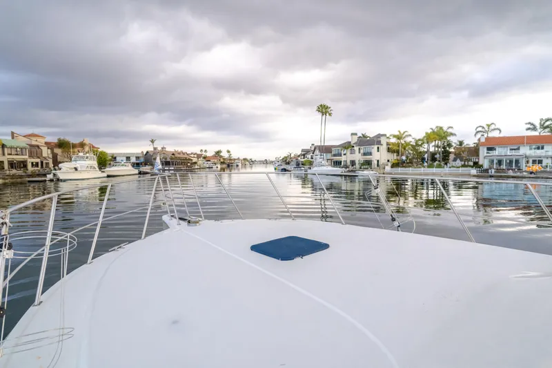 Silvius Brabo Yacht Photos Pics Bow view of 2000 Navigator 53 Classic yacht in a serene marina setting.