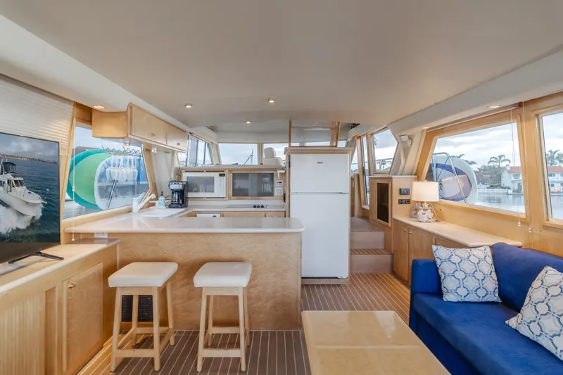 Silvius Brabo Yacht Photos Pics Interior of 2000 Navigator 53 Classic yacht with modern kitchen and seating area.