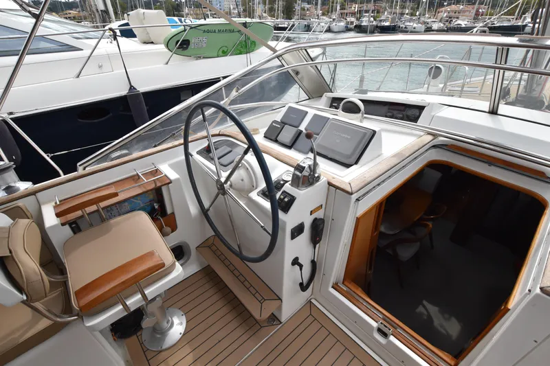 Artemis Yacht Photos Pics Spacious Cockpit of 2004 Beneteau 57sailing yacht, fully equipped with steering wheel and navigation equipment.