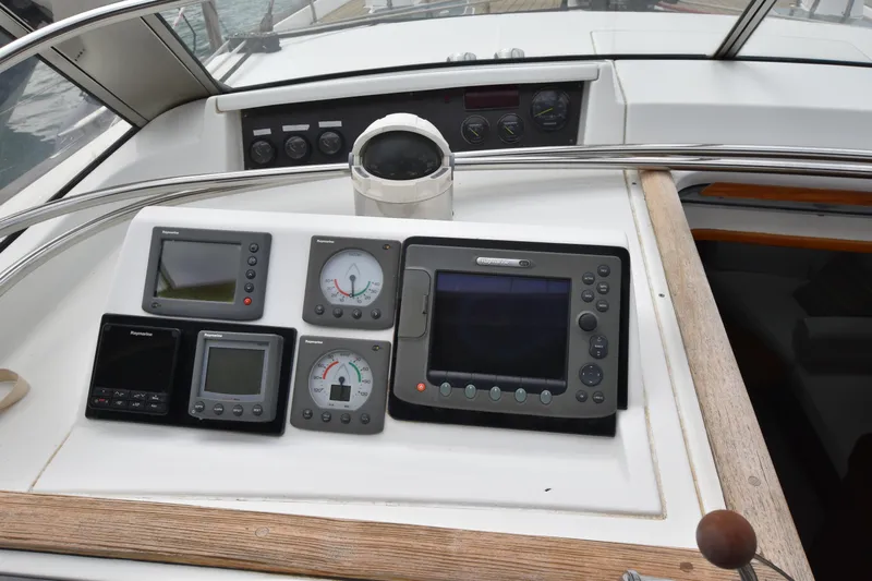 Artemis Yacht Photos Pics Control panel of a 2004 Beneteau 57 yacht with navigation instruments.
