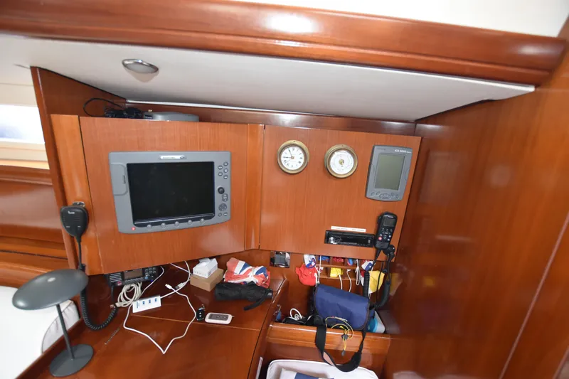 Artemis Yacht Photos Pics Navigation equipment and storage on a 2004 Beneteau 57 yacht interior.