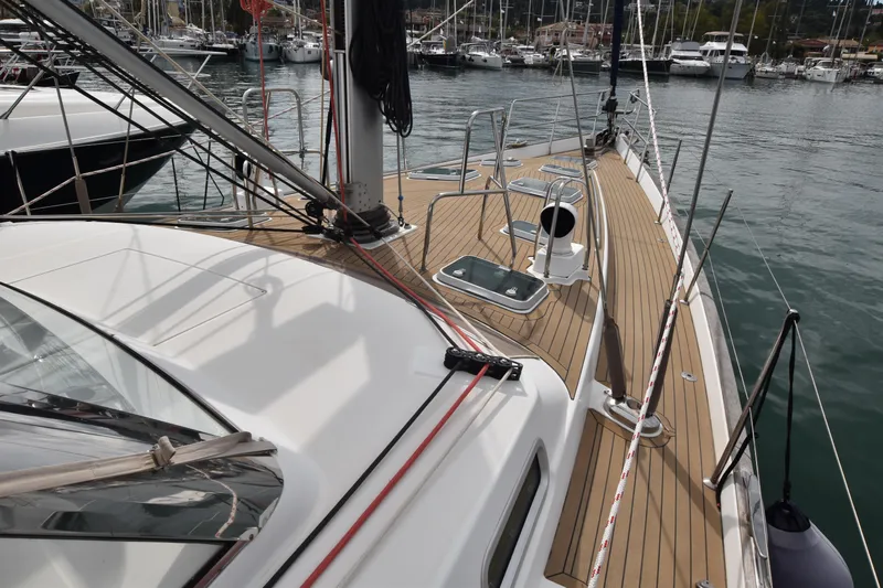 Artemis Yacht Photos Pics 2004 Beneteau 57 yacht deck with sleek design, docked in marina.