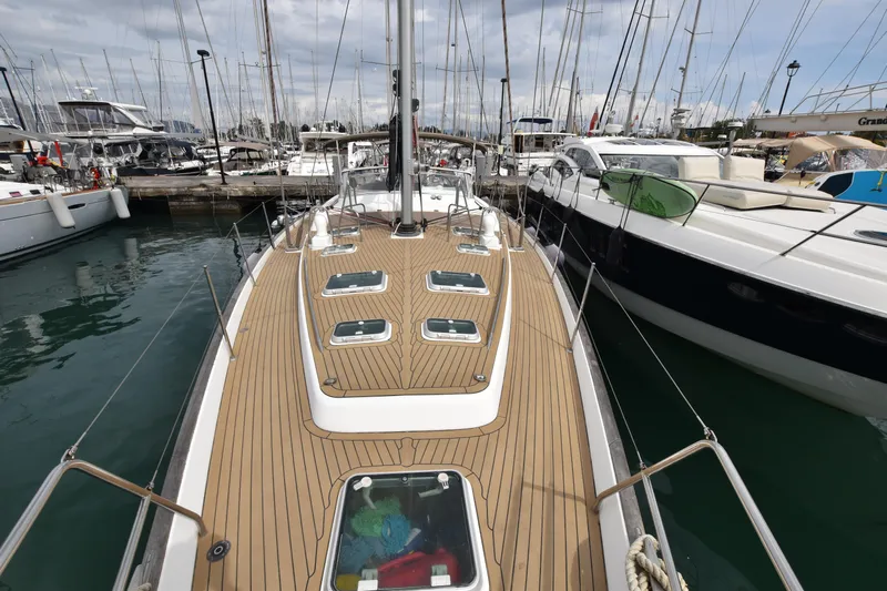 Artemis Yacht Photos Pics 2004 Beneteau 57 sailboat docked in marina, showcasing teak deck and sleek design.