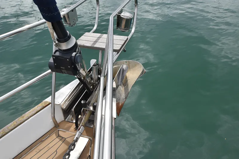 Artemis Yacht Photos Pics Bow of 2004 Beneteau 57 yacht with anchor and winch system in calm water.