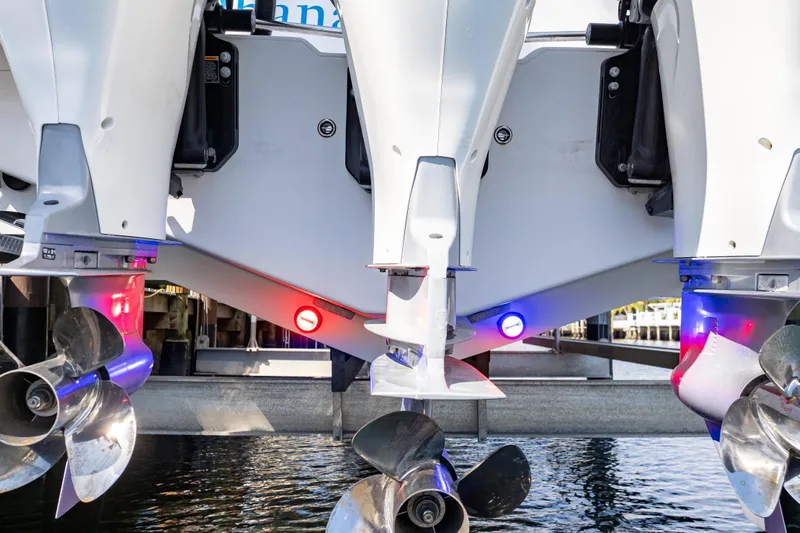  Yacht Photos Pics 2019 Intrepid 407 Cuddy boat engines with illuminated red and blue lights.
