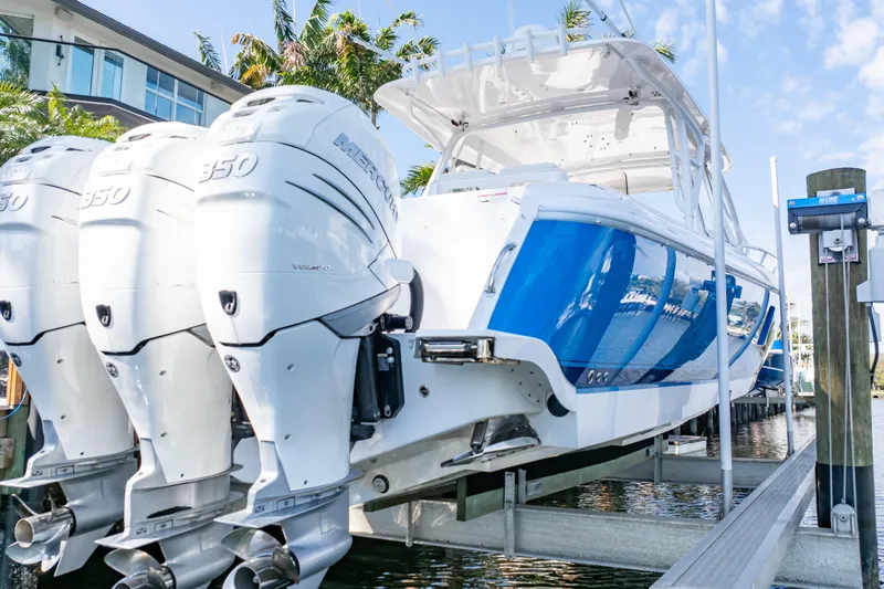  Yacht Photos Pics 2019 Intrepid 407 Cuddy boat with triple Mercury 350 engines on a lift.