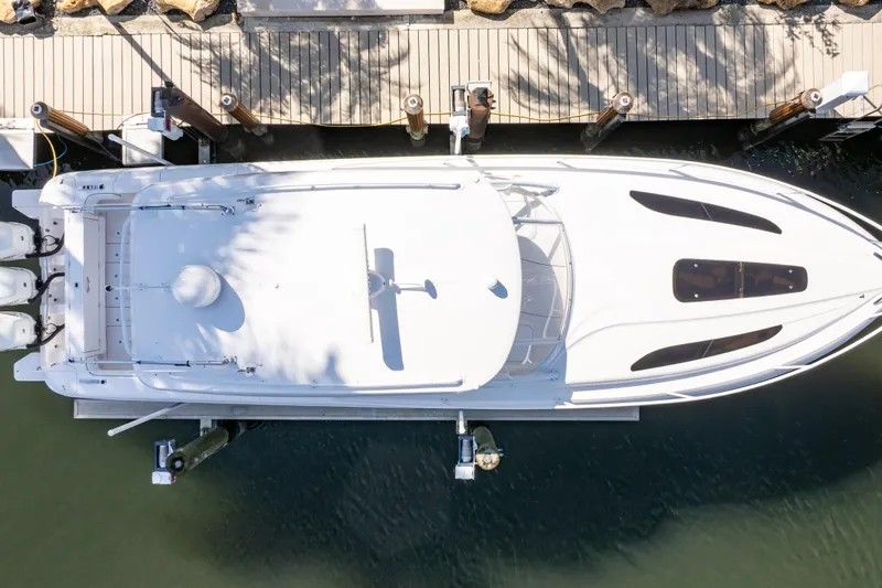  Yacht Photos Pics Overhead view of 2019 Intrepid 407 Cuddy boat docked at a marina.